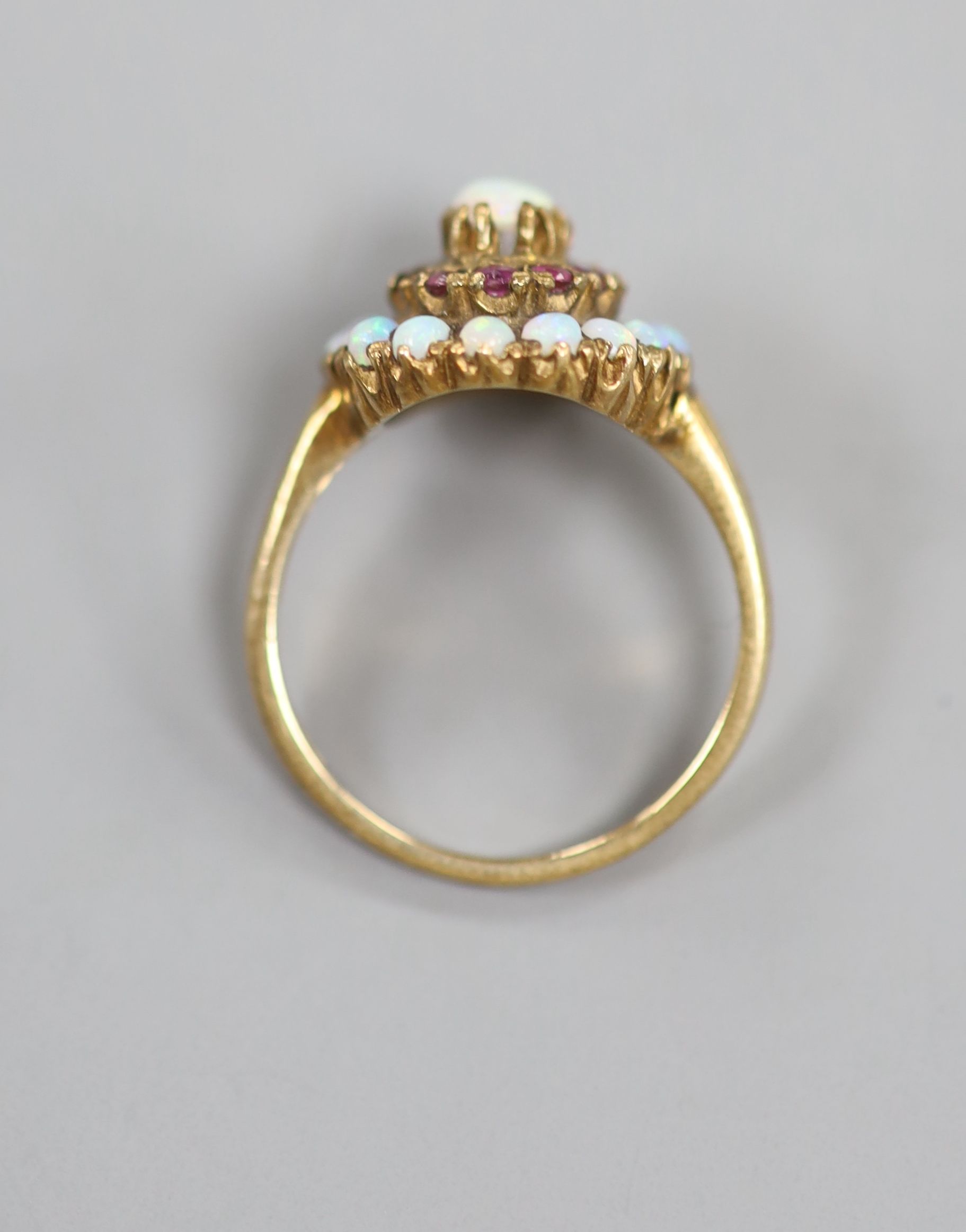 A 1960's 9ct gold, ruby and white opal set cluster ring (ruby missing)